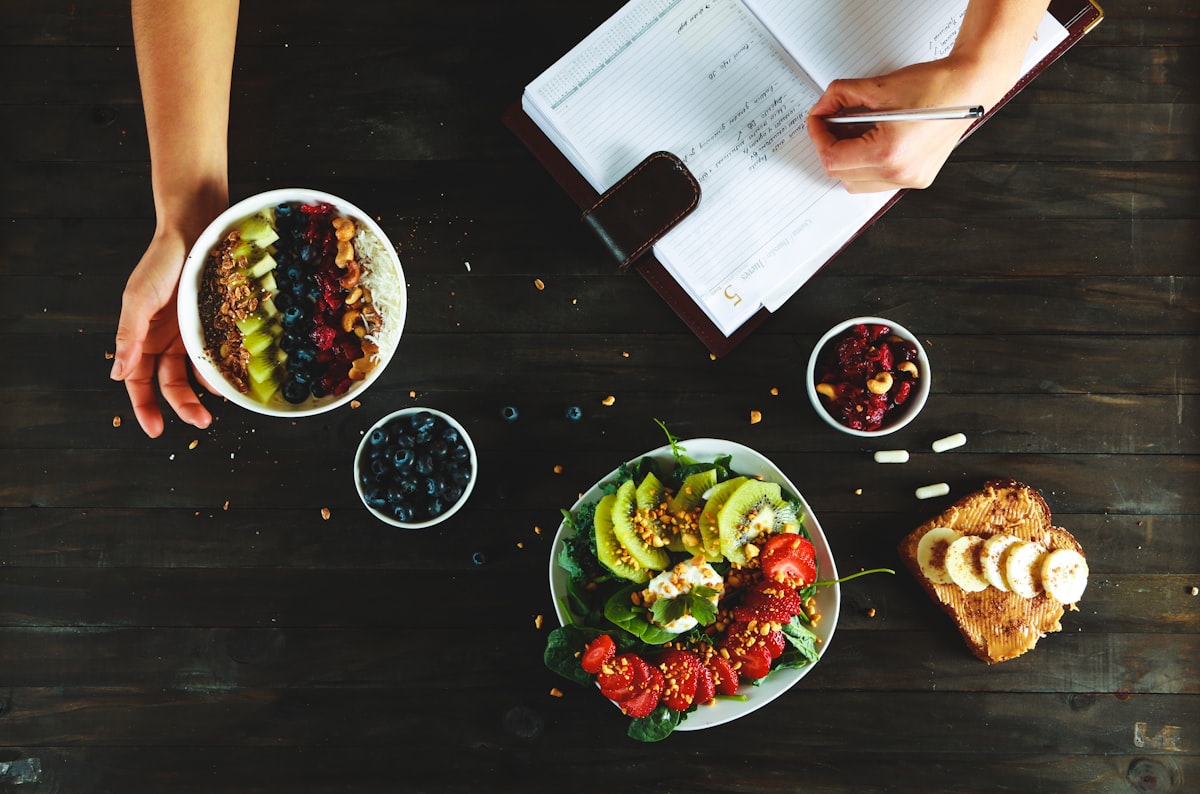 Healthy fats including avocados, nuts, seeds, and olive oil